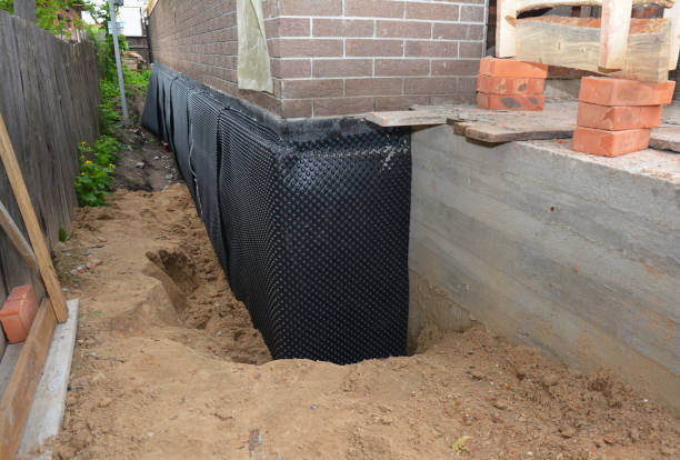 Happy homeowners after waterproofing job in Center Line